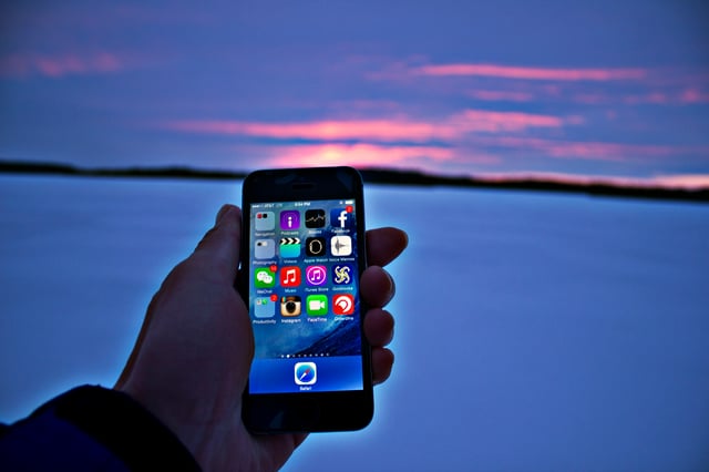 holding phone sunset.jpg